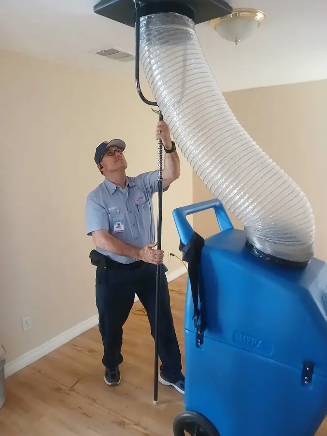 HVAC Installation technician using HEPA equipment in Justin